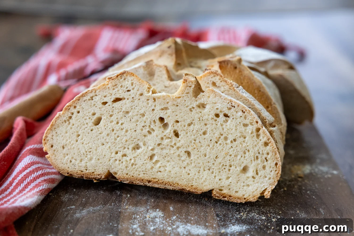 A close-up of the delicious, airy interior of a freshly baked gluten-free sourdough loaf.