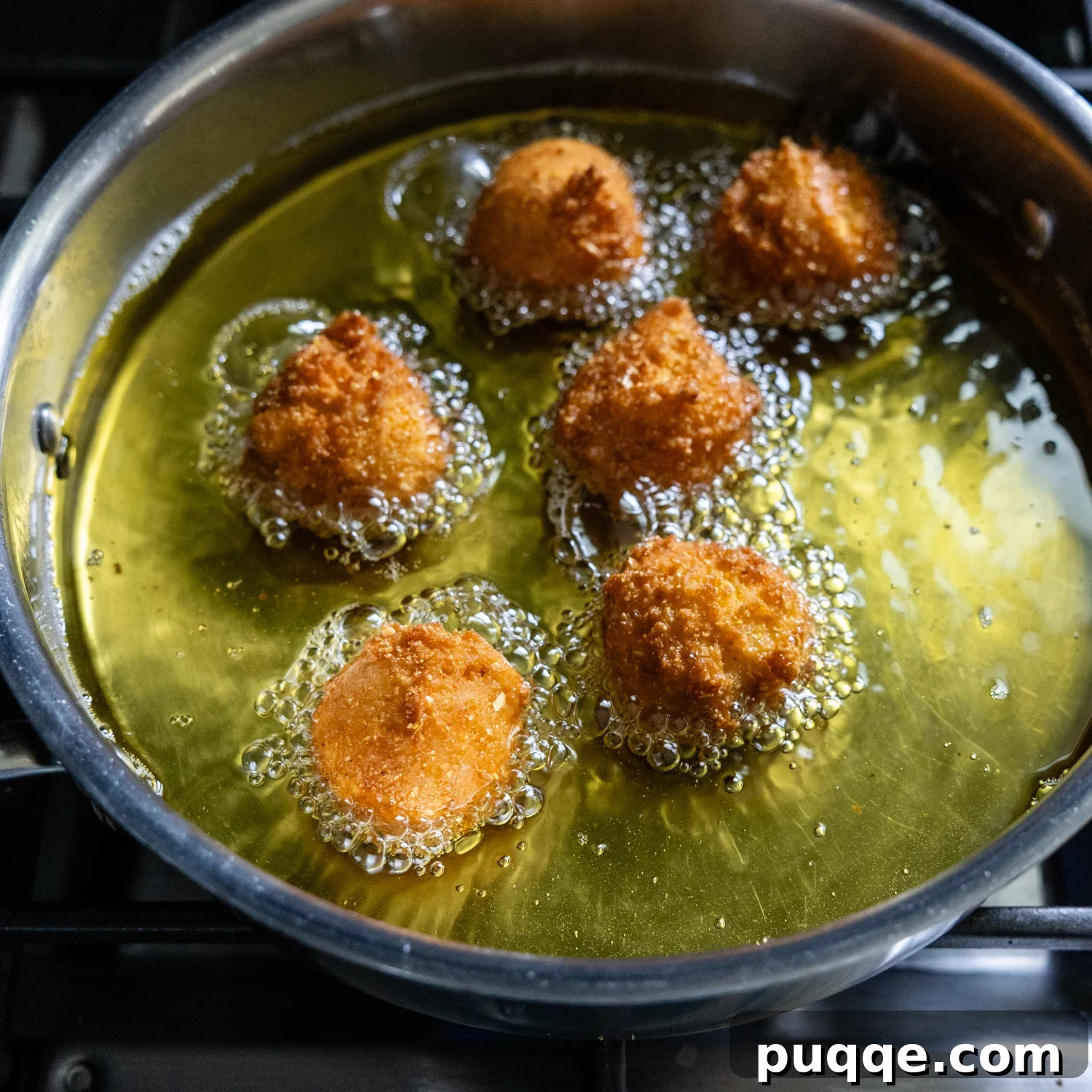 Hush puppy balls being fried.