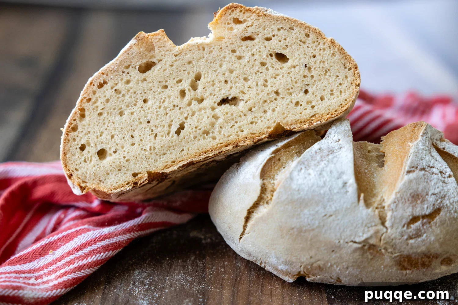 Gluten-Free Sourdough Starter: Reliable Step-by-Step Recipe 8 An inside view of a slice of GF sourdough resting on top of another sourdough loaf.