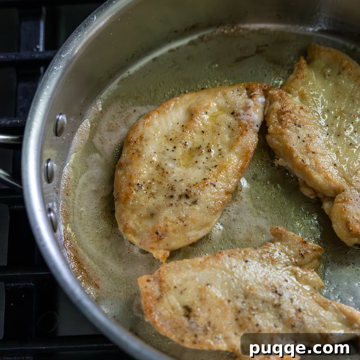 Chicken cutlets being fried.