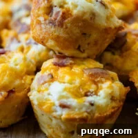 Savory Cheddar Bacon Muffins — Gluten-Free Recipe 3 two savory muffins stacked on top of each other.