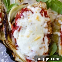 Sheet-Pan Parmesan Roasted Cabbage Wedges 3 top view of cabbage parmesan with bubbly browned cheese on top.