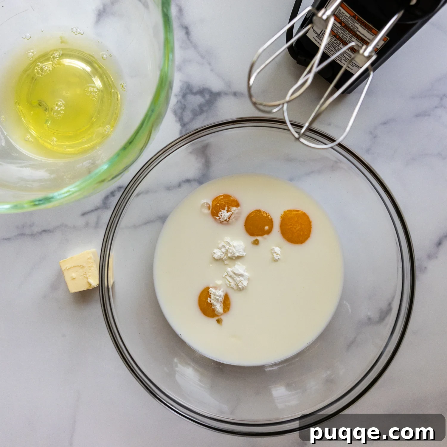 Southern-Style Gluten-Free Banana Pudding (Dolly Parton-Inspired) 3 Eggs and cream of tartar in a mixing bowl.
