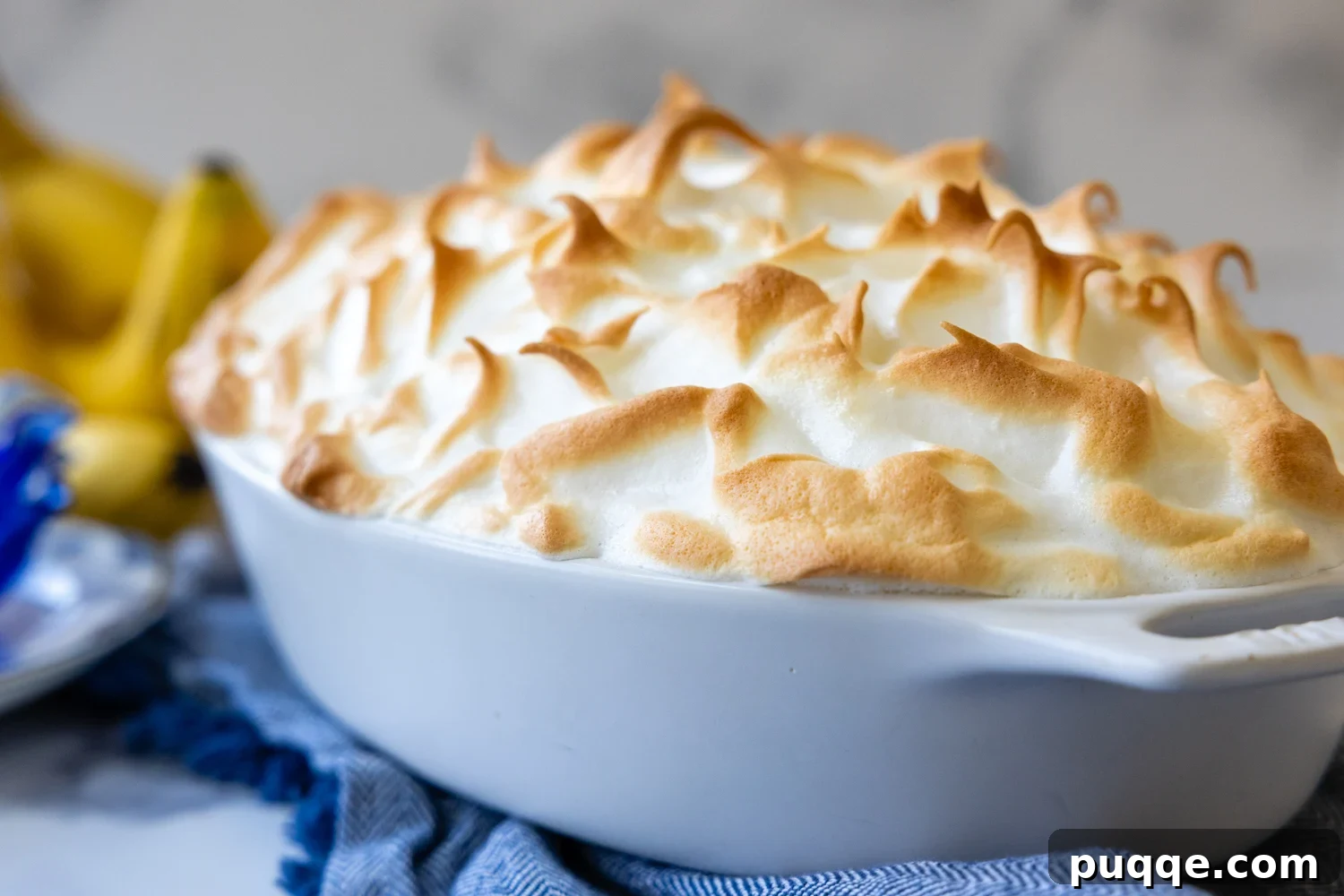 Southern-Style Gluten-Free Banana Pudding (Dolly Parton-Inspired) 10 Cooked peaks of the banana pudding topping in a baking dish.